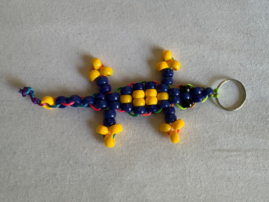 Dark blue and yellow Kandi lizard