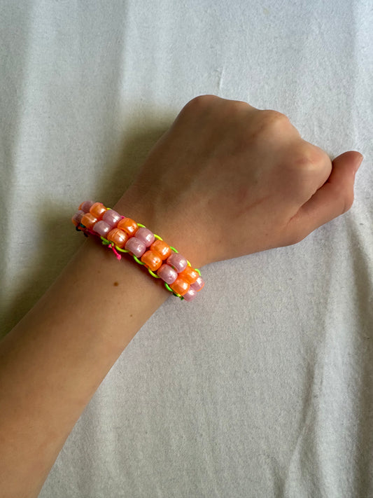 Medium Metallic pink and orange Kandi cuff